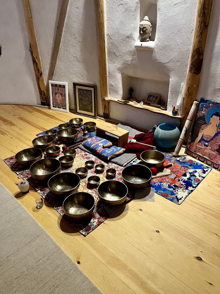 A collection of bowls used in a sound bath at Albergue Verde Camino Frances